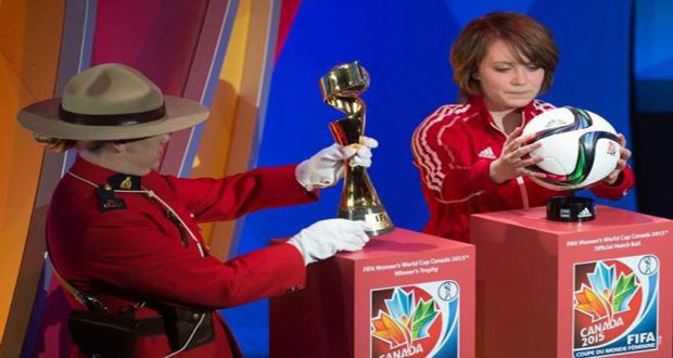 A member of the Royal Canadian Mounted Police carries the FIFA Women's World Cup trophy along with West Ottawa Soccer Club player Talia Laroche who carries the Official Match Ball as part of the preliminary activities surrounding the official draw for the FIFA Women's World Cup Canada 2015 at The Canadian Museum of History. Mandatory Credit: Marc DesRosiers-USA TODAY Sports