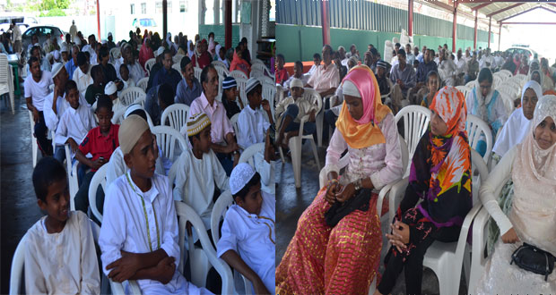 Celebrants observing Youman Nabi yesterday at the Alexander Village Masjid in Alexander Village. Inset is the Guest Speaker who spoke on the topic of health and nutrition (Photos by Cullen Bess-Nelson)