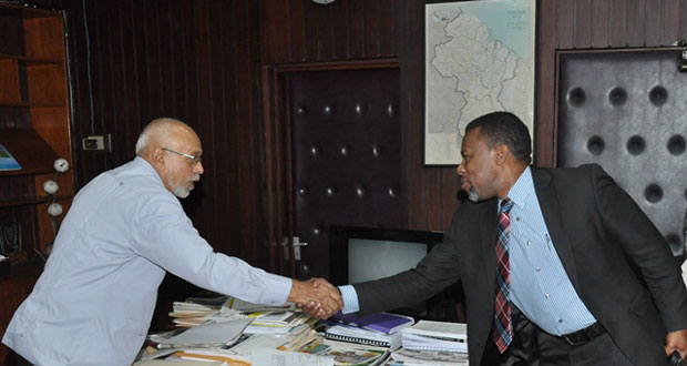 President Donald Ramotar is greeted by Ronald Jackson, Executive Director, Caribbean Disaster Emergency Management Agency (CDEMA)