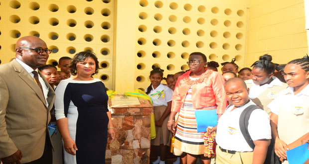 Education Minister Priya Manickchand, CEO Olato Sam, Former Headmistress Dianne Peters and students of the school unveiling the plaque located in the school’s compound.