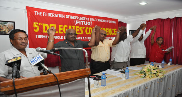 Members of the head table take part in singing ‘Solidarity Forever’