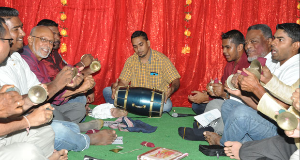 President Donald Ramotar and Prime Minister Samuel Hinds taking part in the Chowtal Samelan hosted by the President and First Lady Deolatchmee Ramotar at State House to usher in the season of Holi (Phagwah)