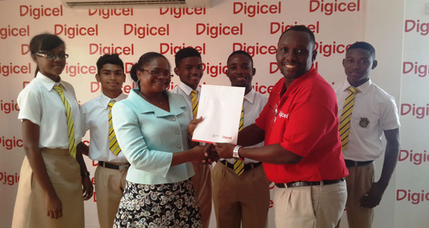 Mathematics Head of Department, Ms. Lenise Parker receives a cheque from Sponsorship/Events Manager Gavin Hope as some of the student participants look on
