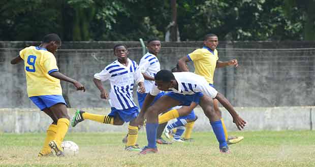Western Tigers’ star striker `Tiger’ on the attack in GFC’s defence area during yesterday’s quarter-final action in the Frank Watson Memorial Football Tournament at the GFC ground. (Photo by Samuel Maughn)