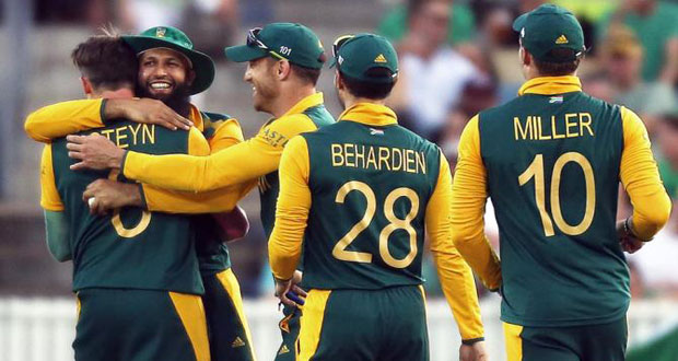 South Africa's Hashim Amla (back L) celebrates with teammates after catching Ireland's Ed Joyce out for a duck.