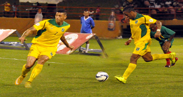 Matthew Briggs (left) and Neil Danns during their International debut for Guyana against Grenada at the Guyana National Stadium. (Delano Williams photo)