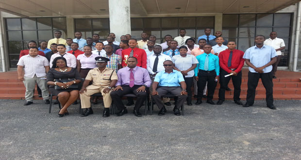 The 37 ranks to be added to the CID pose with one of the facilitators, Attorney-at-Law, Joann Edghill; Force Training Officer, Paul Williams; Deputy Crime Chief, Wendell Blanhum; and senior officer, De Hearte at the conclusion of the closing ceremony Thursday (Photo by Michel Outridge)