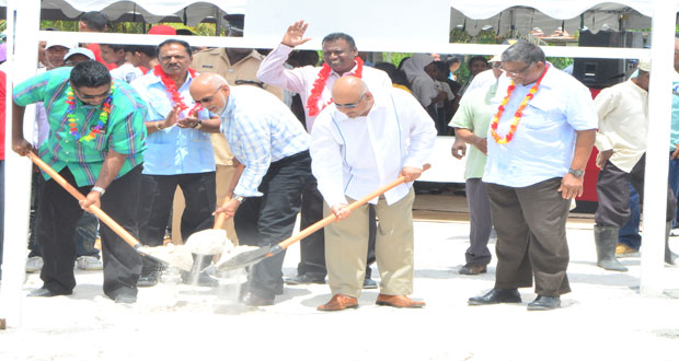 ‘GROUND-BREAKING’: President Donald Ramotar, Minister Irfaan Ali and Dr. Suresh Narine turn the sod at the site where the multi-million-dollar Rice Cereal Manufacturing Facility at Anna Regina will be built. Looking on, in this Adrian Narine photo, are Labour Minister, Dr. Nanda Gopaul (right), Minister within the Ministry of Agriculture, Mr. Ali Baksh and Region Two Chairman, Mr. Parmanand Persaud