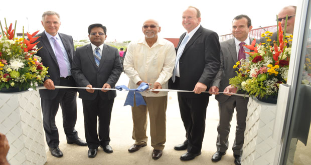 From left, Mr Kirk Laughlin, Finance Minister Dr. Ashni Singh, President Donald Ramotar, Qualfon’s CEO (Guyana) Mr Mike Marrow and Qualfon’s Founder and Chairman Mr Alfonso Gonzalez at the commissioning of the company’s training  center at Providence yesterday (Delano Williams photo)