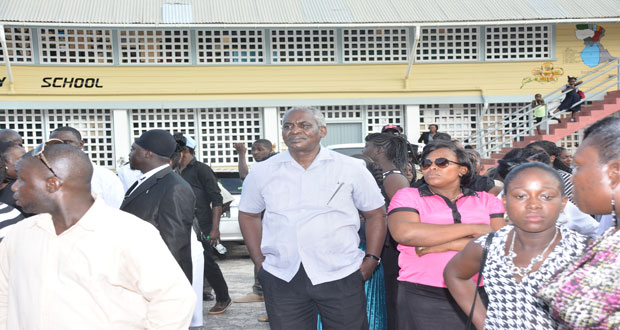 Transport Minister, Robeson Benn at the funeral for the two girls yesterday (Photos By Samuel Maughn)