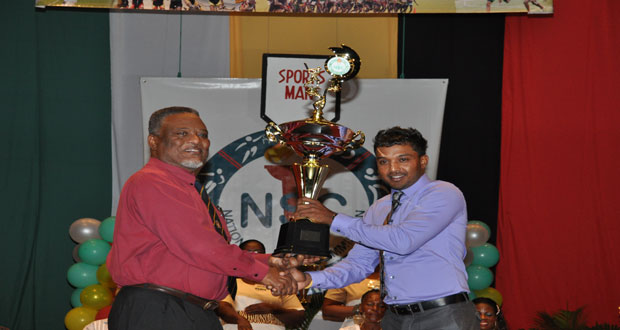 Sportsman of the Year Veerasammy Permaul (right) is delighted in receiving his award from Prime Minister Samuel Hinds.