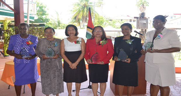 First Lady Deolatchmee Ramotar with women who were honoured for their contributions to Guyana