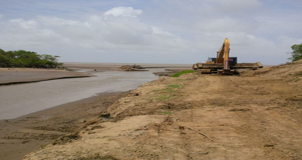 Caption: One of the excavators at the outfall channel
