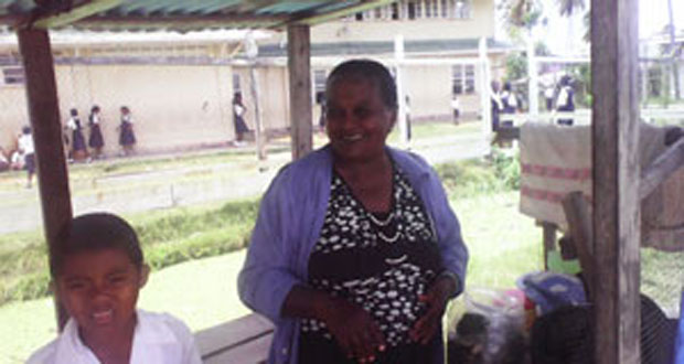 ‘Aunty Bootie’ is all smiles and merriment as she tends to the needs of the little ones at Gibson Primary School