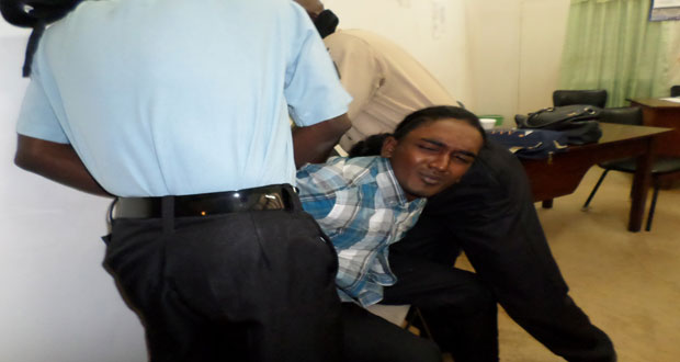 Azim Shivgobin resisted being arrested at the Berbice High Court on Wednesday