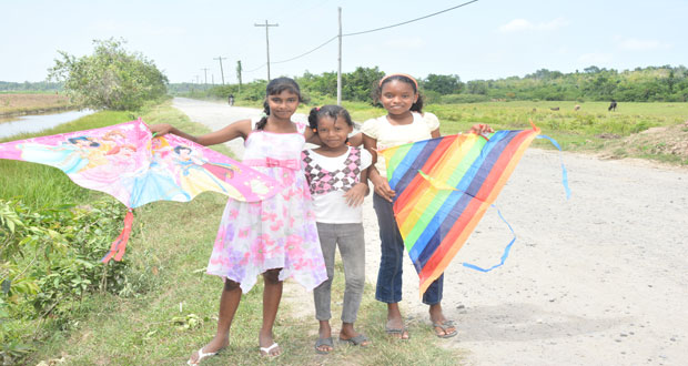These children are about to fly their kites yesterday at Viva-La-Force, West Bank Demerara.(Samuel Maughn photos )