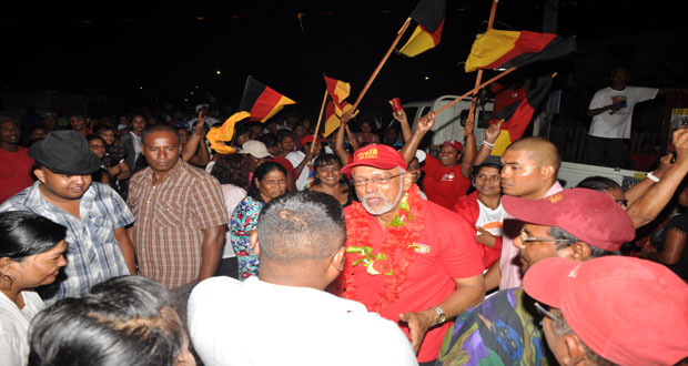 President Donald Ramotar gestures to supporters at Foulis last evening