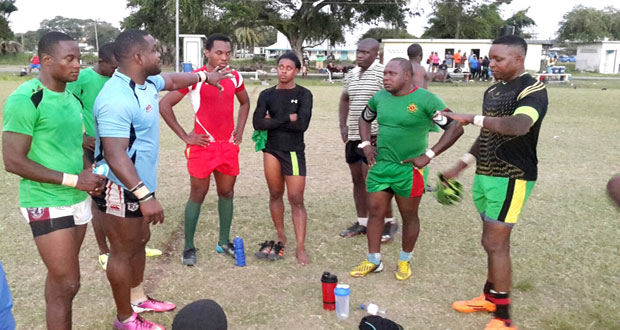 Kevin McKenzie (second from left) makes a point during training at the National Park.