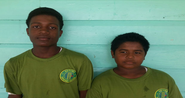 Centurion Robin Williams (right) and Alphius Bookie strikes a pose for Chronicle Sport after their 163 runs third wicket partnership against USACA Academy Under-15 team at the Police Sports Club ground, Eve Leary yesterday.