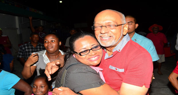 President Donald Ramotar gets a warm hug from this Essequibo resident 