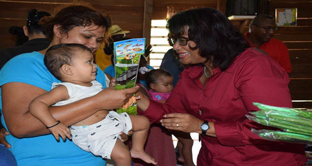 PPP/C Prime Ministerial Candidate Elisabeth Harper distributing kites, and mingling with the children