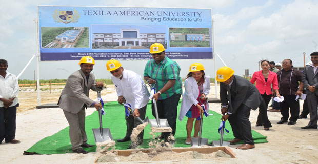 Texila American University founder Saju Bhaskar, President Donald Ramotar and Housing Minister Irfaan Ali join other university officials in turning the sod for the construction of the US$20 million university campus at Providence, East Bank Demerara.