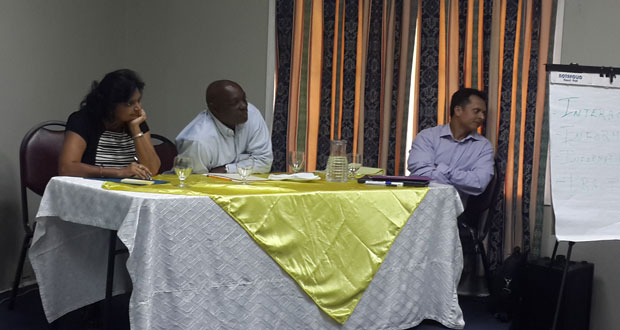 From left are Deputy Chief Education Officer, Ms. Doodmattie Singh, along with Mr. Gordon Gilkes from the Georgetown Solid Waste Management Programme, and Guyenterprise’s Mr Oliver Insanally in full discussion at the workshop