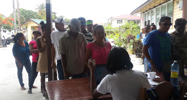 Persons at the information desk to ensure their names are on the voter’s list