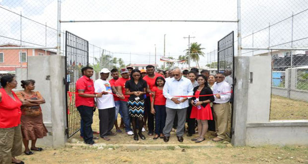 President Donald Ramotar cuts the symbolic ribbon to open the De Edward Village Volleyball court