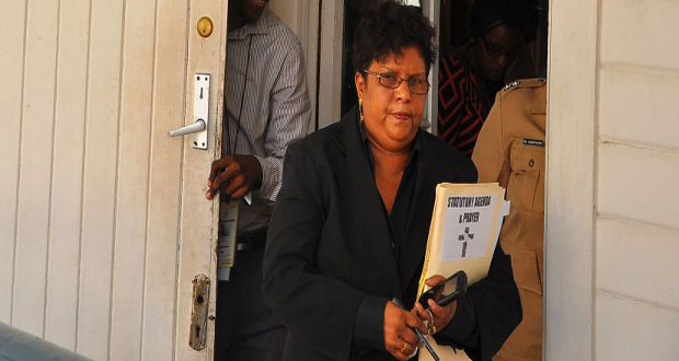Town Clerk Carol Sooba leaves the Council Chamber