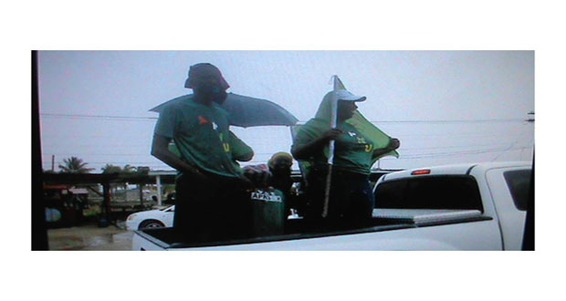 Supporters on a vehicle in the APNU+AFC motorcade on the Essequibo Coast. The rain failed to stop it