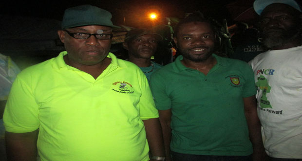 APNU’s Sharma Solomon (right) and AFC’s Audwin Rutherford at Monday night’s Thanksgiving Service