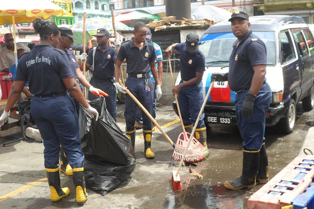 Fire fighters cleaning the No. 41 and 45 bus park