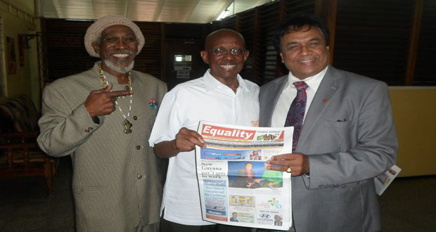 Mayor Hamilton Green is flanked by Ras Leon Saul and Mr. Bhaskar Sharma at the Guyana Chronicle