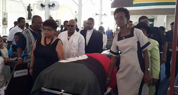 The casket bearing the body of the Deputy Mayor being wheeled from the church