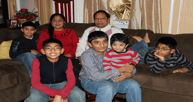 ‘PROUD GRANDPARENTS’: Mr and Mrs Moses Nagamootoo, share a treasured moment with their grandsons (from left) Alexander, Brandon, Wayne, Mark and Nathaniel