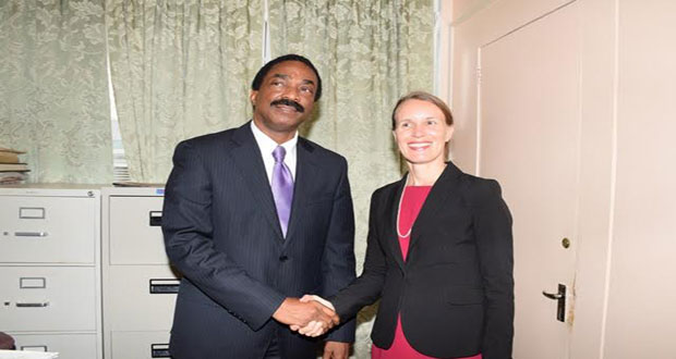 Attorney General and Minister of Legal Affairs Basil Williams greeting Canadian High Commissioner Dr. Nicole Giles