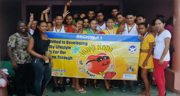 The winning Region One team at the National Schools Physical Display Championships. At left is REDO, Mrs. Doreen Roberts, while at extreme right is Alicia Wong, the coach