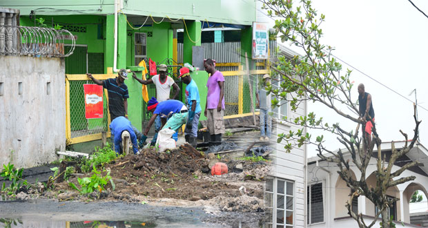 Charlotte Street residents pitching in their lot yesterday in the ongoing drive to return Gergetown to its former glory (Photos by Samuel Maughn)