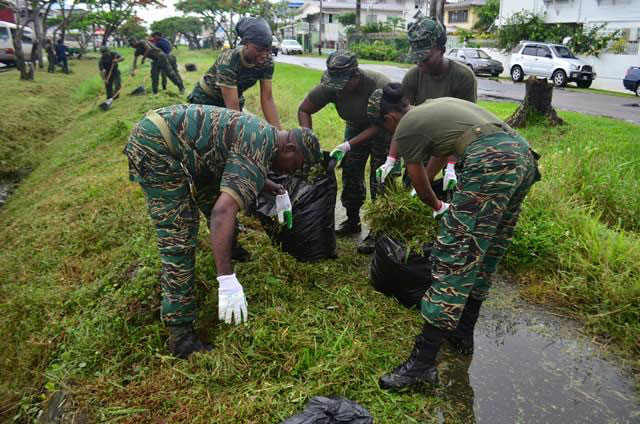 Members of the Guyana Defence Force engaging in the clean-up activities