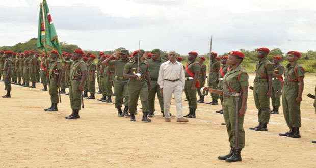 President David Granger inspects the Guard of Honour at the passing out parade for the Basic Recruit 2015/01 Course, at the Colonel John Clarke Military School, Tacama, Upper Berbice River