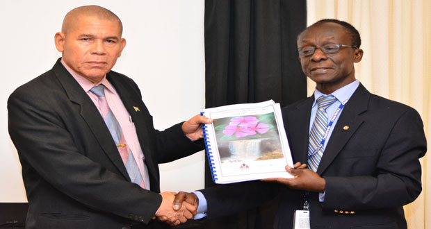 Dr. William Adu-Krow hands over the report to Minister of Public Health, Dr. George Norton