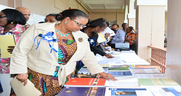 Minister of Social Protection, Ms. Volda Lawrence browsing through some of the displayed literature