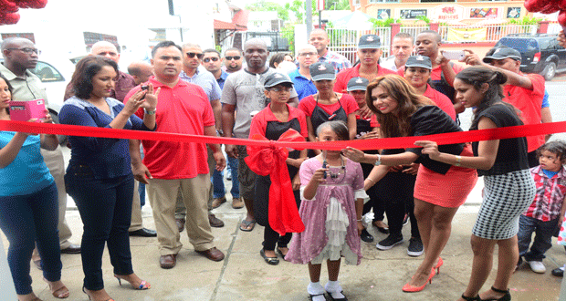 Staffers and well-wishers gathered Saturday to witness the cutting of the ribbon