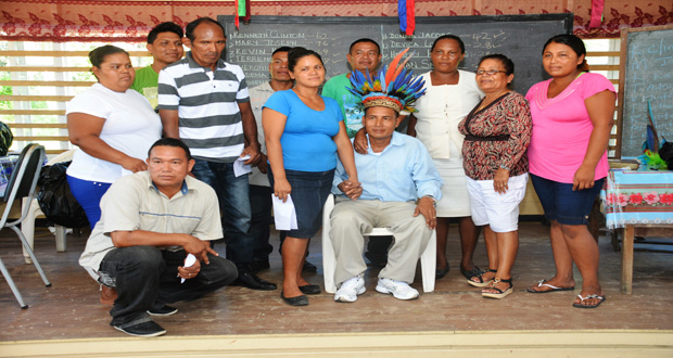 Newly elected members of the Village Council pose for a picture with the new Toshao (center)