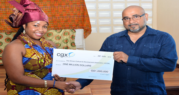 ACDA’s Aisha Jean -Baptiste receiving the cheque from CGX Energy’s Professor Suresh Narine (Photo by Samuel Maughn)