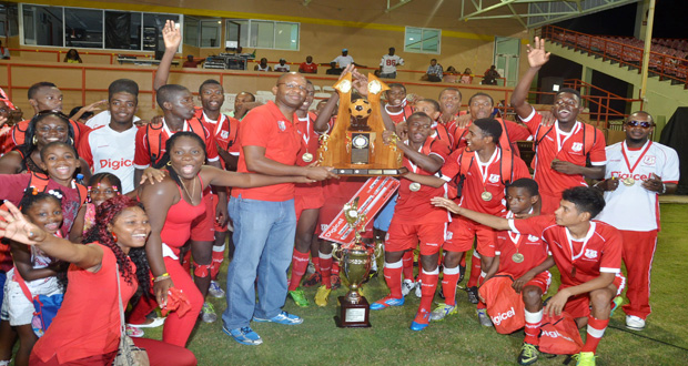 Flashback! Former Digicel Guyana CEO Gregory Dean presents ‘Multi’ with their third consecutive title at the Guyana National Stadium, Providence, last year.