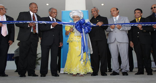 Ceremonial cutting of the ribbon to open the Debe-Penal campus in southern Trinidad of the UWI St Augustine. From left, UWI St Augustine Campus Principal, Clement Sankat; UWI Vice-Chancellor, Sir Hilary Beckles; Chancellor of the UWI, Sir George Alleyne; Prime Minister of Trinidad and Tobago, Kamla Persad-Bissessar; President of Guyana, David Granger; Trinidad’s Tertiary Education and Skills Training Minister, Senator Fazal Karim; and Trinidad’s Housing and Urban Development Minister, Dr Roodal Moonilall (Photo courtesy of UWI St Augustine).