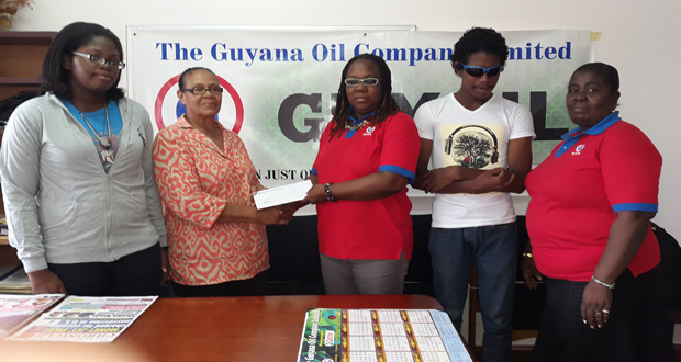 Theresa Pemberton, treasurer of the Guyana Blind Cricket Association, is receiving the cheque from Managing Director (ag) of GUYOIL, Lesley Benjamin. National players Crystal Aulder and Musa Haynes, along with GUYOIL’s Senior Confidential Secretary Lynette Riddle share the moment.