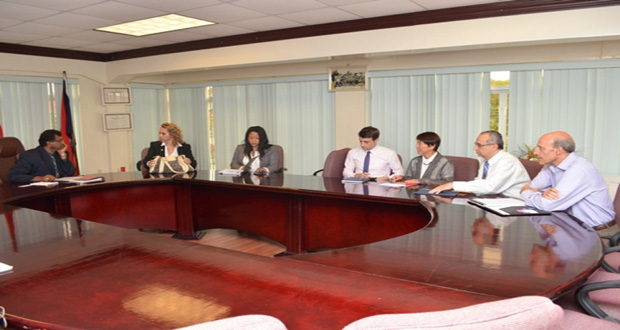  IDB Country Representative, Ms Sophie Makonnen (second left), and members of her team in discussion Monday with Minister of Public Security, Mr Khemraj Ramjattan (left) at his office on Brickdam
